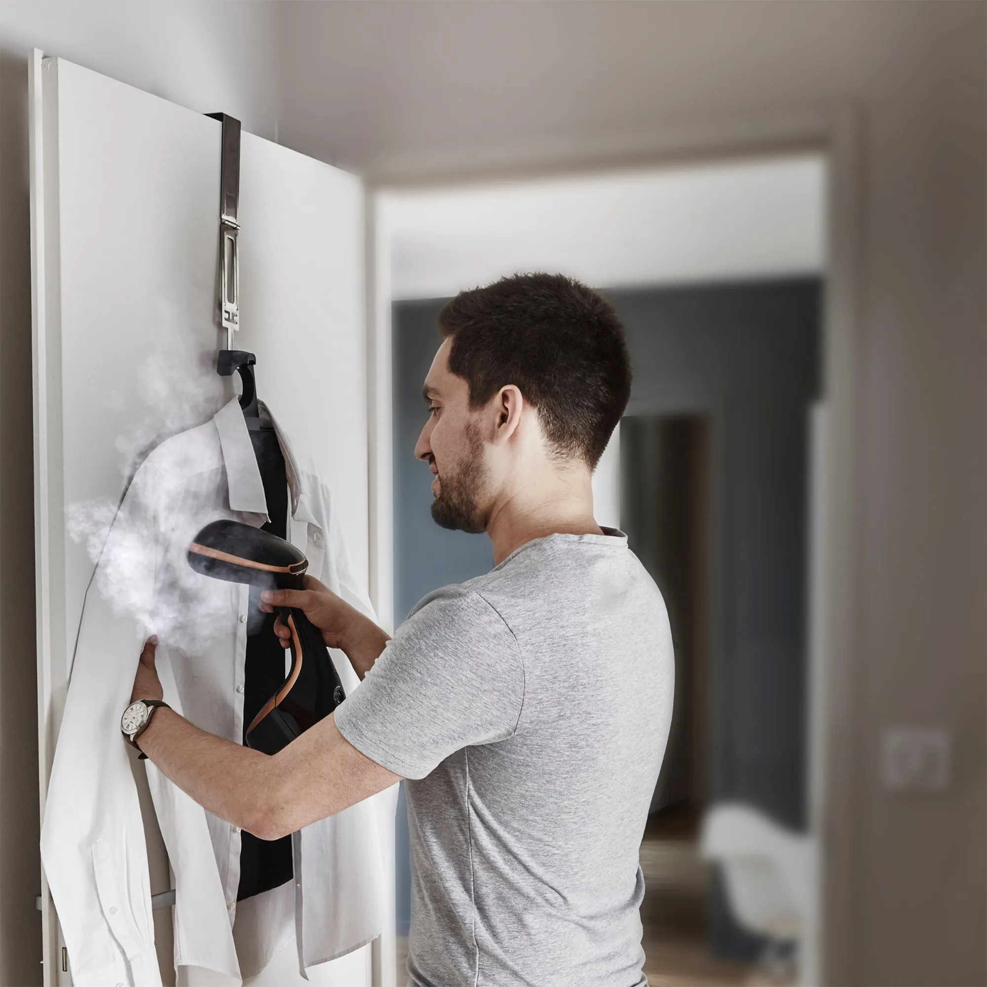 Tefal Access Steam Care Handheld Garment Steamer DT9120 vertical steaming in use