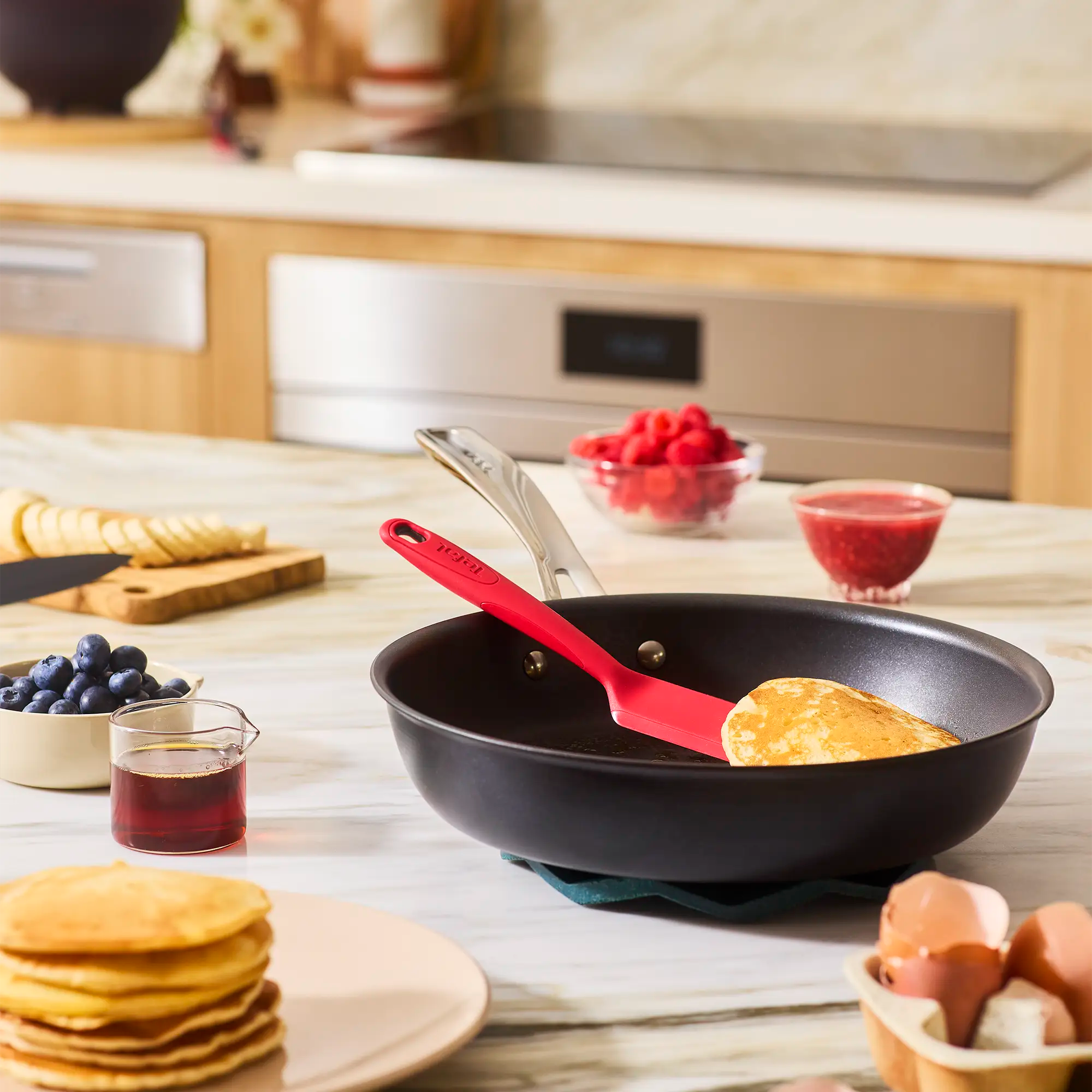 Tefal Excellence+ Induction FusionCore Non-Stick Frypan on kitchen bench