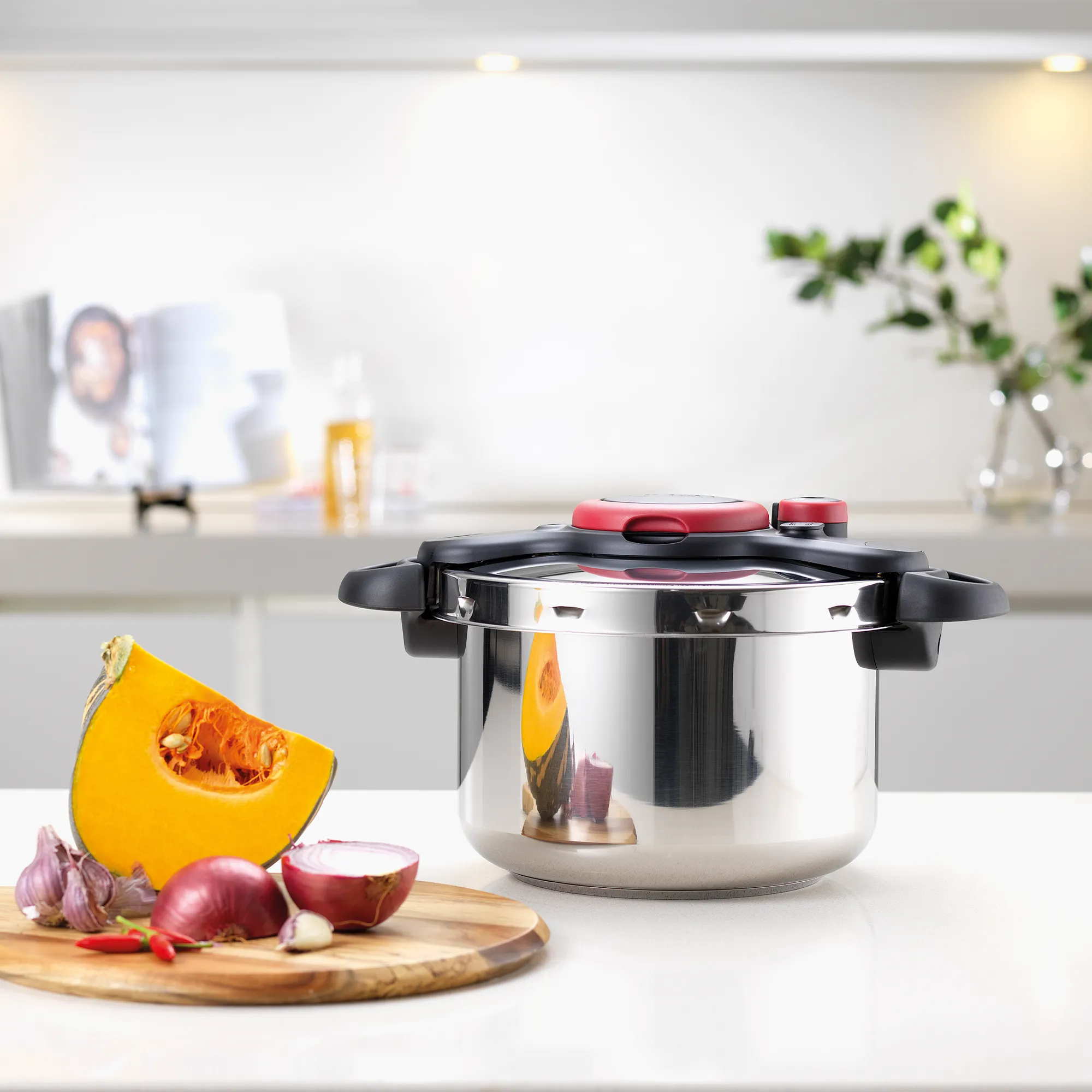 Tefal Clipso Minut' Easy 7.5L Pressure Cooker on kitchen bench with ingredients