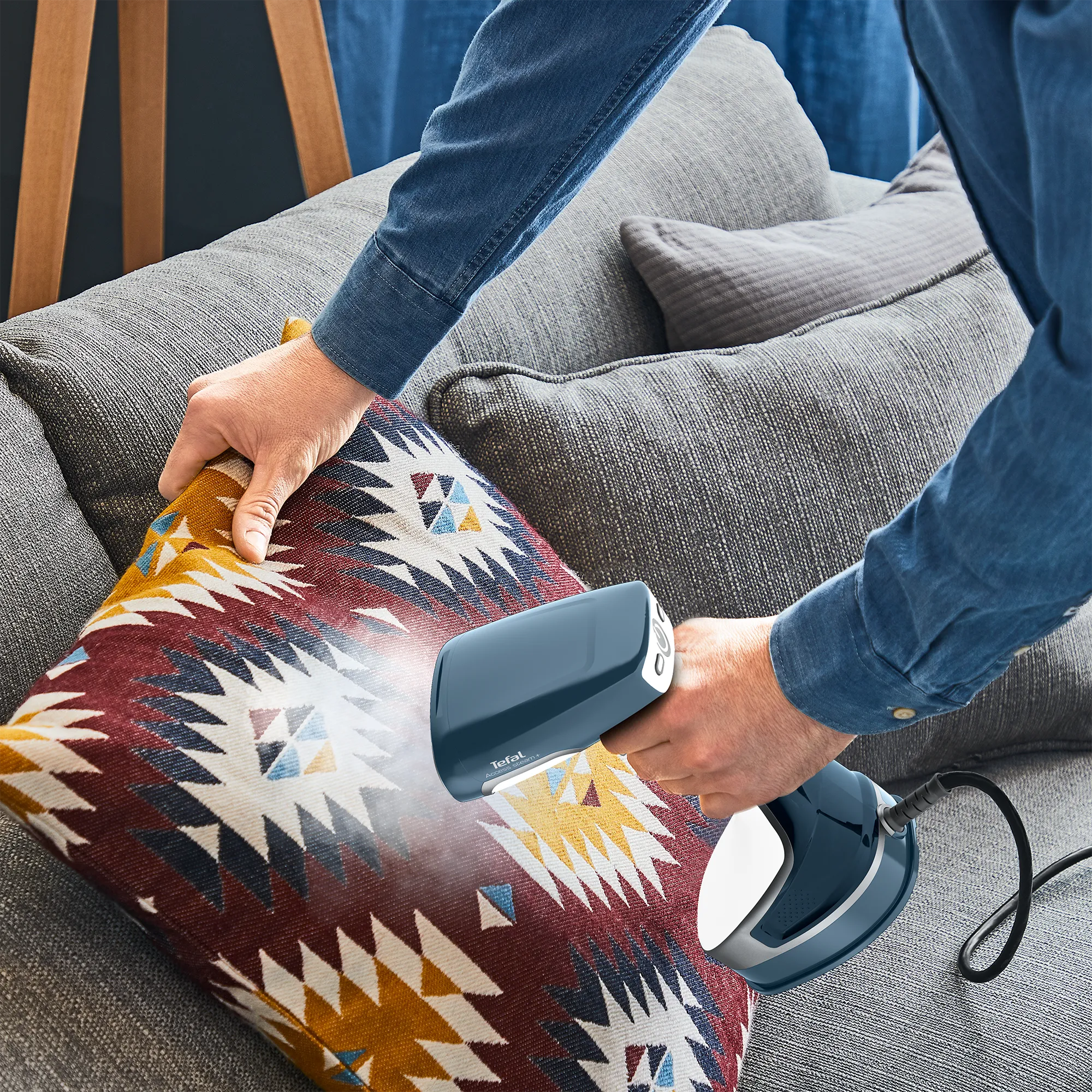 Tefal Access Steam+ Handheld Garment Steamer DT8100 in use sanitising pillow