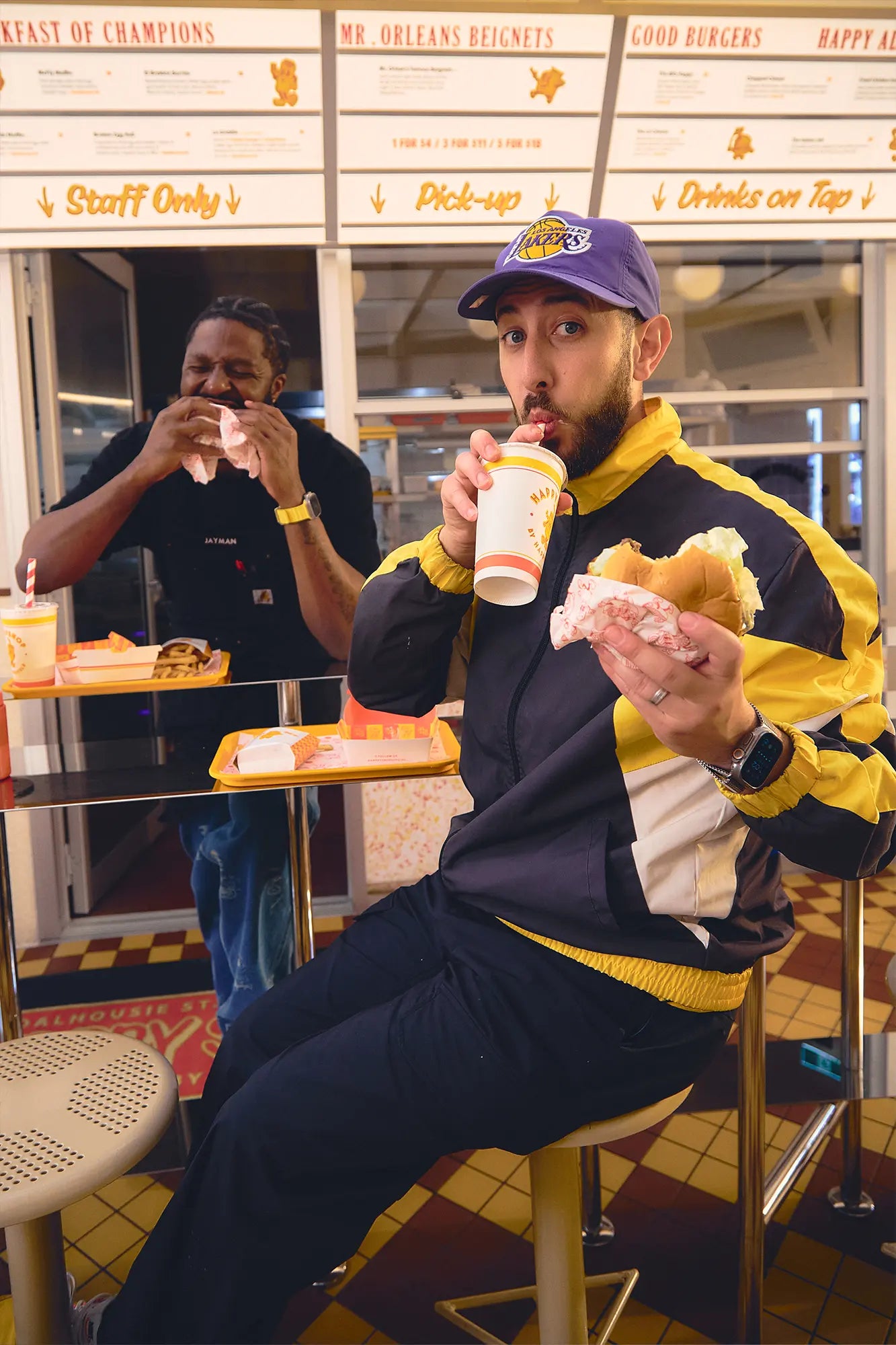 Chris Theodosi & Jesse Orleans owners of Happyfield enjoying their smash burger