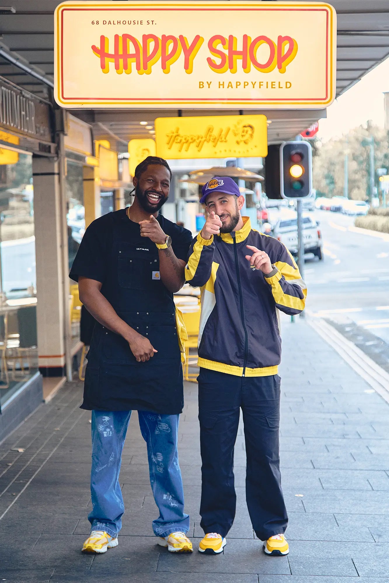 Chris Theodosi & Jesse Orleans standing in front of Happyshop